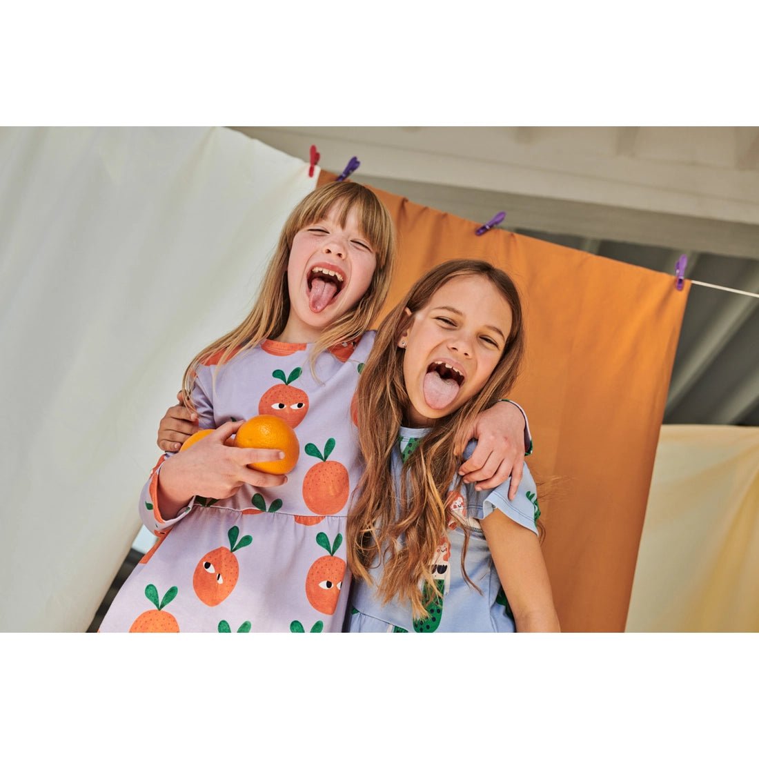 e1e174d80c8b54510e58693f3cb42744d3bcc1bda6b42bcb03fa1a2b0eb7d8d9 Oranges On Purple Dress - Image 2